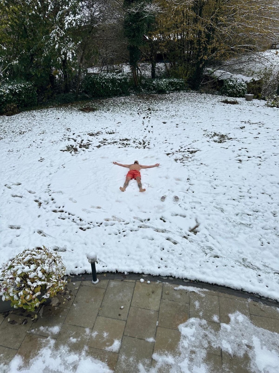Snow angel after the ice bath in a snowy garden
